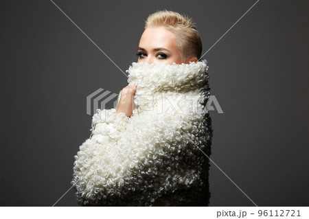 young short blond hair woman in white fur. beautiful bald girl young short blond hair woman in white fur. beautiful bald girl 96112721