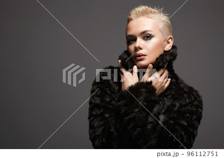young short blond hair woman in fur. beautiful girl 96112751