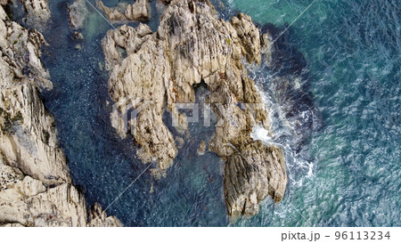 A lot of boulders in the sea water. Coastal cliffs of the North Atlantic. Seaside beautiful nature. Dramatic seascape of the north of Europe. A lot of boulders in the sea water. Coastal cliffs of the North Atlantic. Seaside beautiful nature. Dramatic seascape of the north of Europe. 96113234