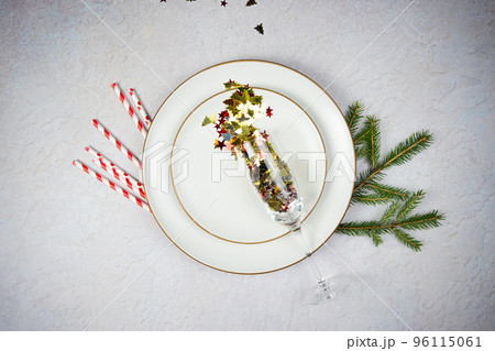 Empty Plate with Christmas decorations and fir tree on wooden background, flat lay. 96115061