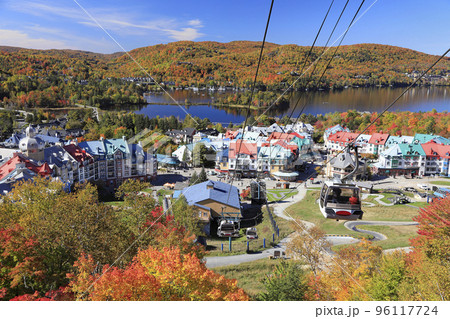 Lake and Mont Tremblant resort in autumn with cable car on the foreground, Canada Lake and Mont Tremblant resort in autumn with cable car on the foreground, Canada 96117724
