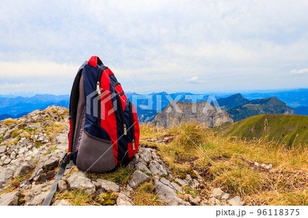 Tourist backpack on background of mountains in Swiss Alps. Travel outdoor concept 96118375