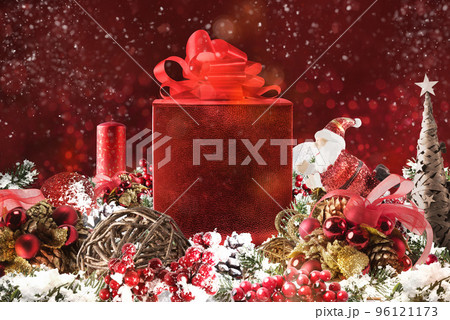 Christmas background concept. Shimmering Christmas decorations with gift, tree, Santa Claus and candles Christmas background concept. Shimmering Christmas decorations with gift, tree, Santa Claus and candles 96121173