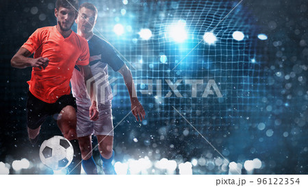 Close up of a challenge between soccer players with a soccer goal in the background Close up of a challenge between soccer players with a soccer goal in the background 96122354