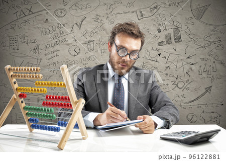 Nerd accountant does calculation of company revenue 96122881