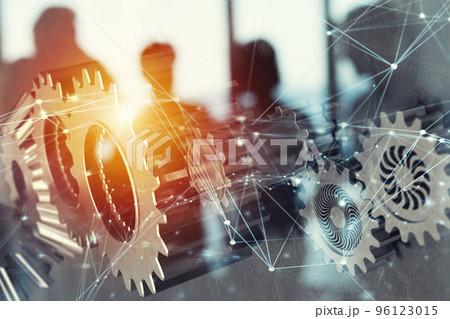 Business team with gears system. Teamwork, partnership and integration concept with network effect. double exposure 96123015