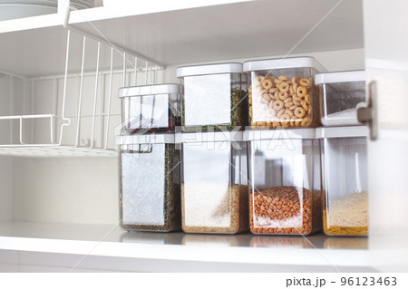 Storage ideas in the kitchen. White box and basket. Shelf order system. Storage ideas in the kitchen. White box and basket. Shelf order system. 96123463