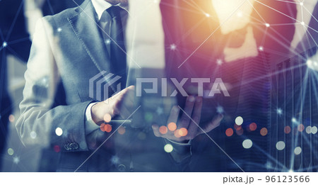 Businessmen that works with his laptop. Concept startup company. double exposure Businessmen that works with his laptop. Concept startup company. double exposure 96123566