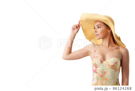 Girl with hat at the beach with a bright sea 96124268