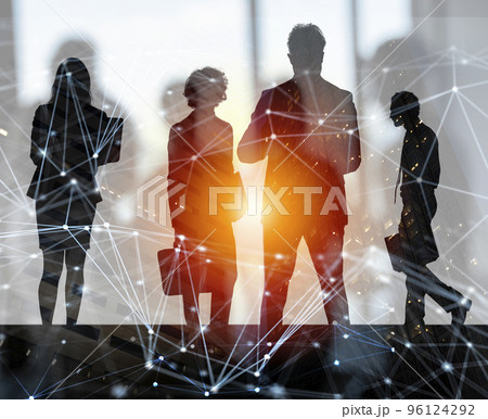 Business people work together in office with internet network effects. Concept of teamwork and partnership. double exposure Business people work together in office with internet network effects. Concept of teamwork and partnership. double exposure 96124292