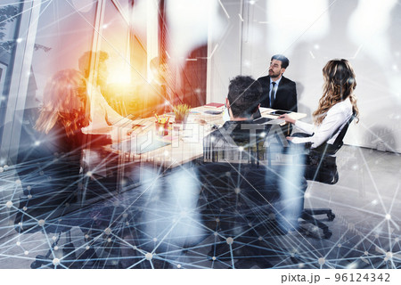 Business people work together in office with internet network effects. Concept of teamwork and partnership. double exposure Business people work together in office with internet network effects. Concept of teamwork and partnership. double exposure 96124342