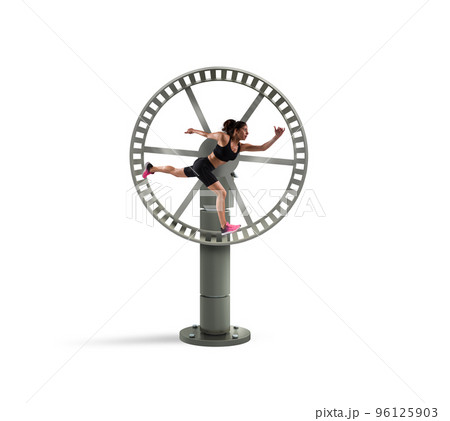 Athletic woman runs in a looping wheel. concept of sport routine 96125903
