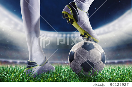 Soccer player with soccerball at the stadium ready for the match 96125927