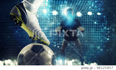 Close up of a soccer striker ready to kicks the ball in the football goal Close up of a soccer striker ready to kicks the ball in the football goal 96125957