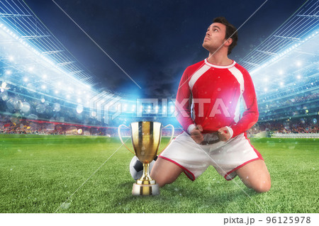 Golden winner's cup in the middle of a stadium with audience 96125978