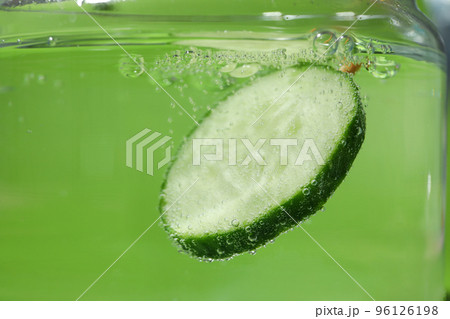 Concept of summer, cucumber slice in water Concept of summer, cucumber slice in water 96126198