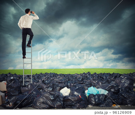 Businessman on a stairs searches far for clean environment. overcome the global pollution problem Businessman on a stairs searches far for clean environment. overcome the global pollution problem 96126909