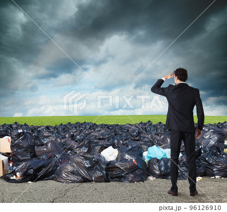 Businessman searches far for clean environment. overcome the global pollution problem 96126910
