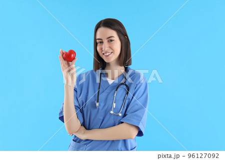 Concept of profession, young female doctor on blue background Concept of profession, young female doctor on blue background 96127092