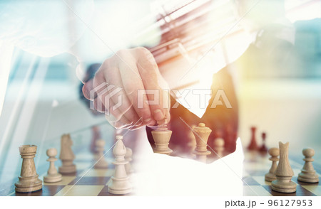 Business strategy with chess game and handshaking business person in office. concept of challenge and tactic. double exposure Business strategy with chess game and handshaking business person in office. concept of challenge and tactic. double exposure 96127953