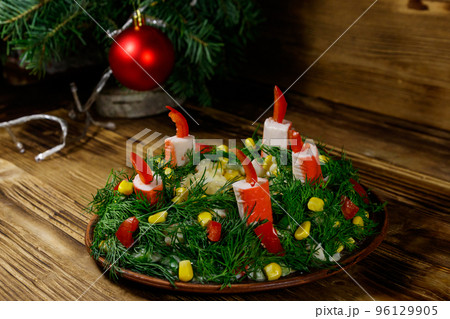 Salad Christmas wreath on a wooden table Salad Christmas wreath on a wooden table 96129905