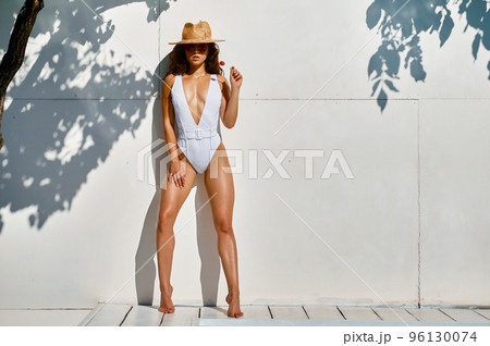 Portrait of trendy fashion woman in swimsuit Portrait of trendy fashion woman in swimsuit 96130074