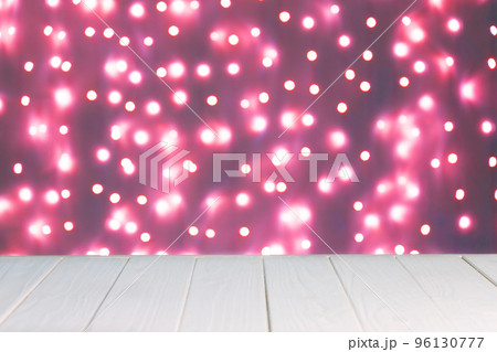 Abstract background, mockup. Defocused pink lights bokeh and white wooden surface Abstract background, mockup. Defocused pink lights bokeh and white wooden surface 96130777