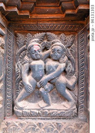 Erotic wooden carving motif on a Hindu temple in Nepal 96131303