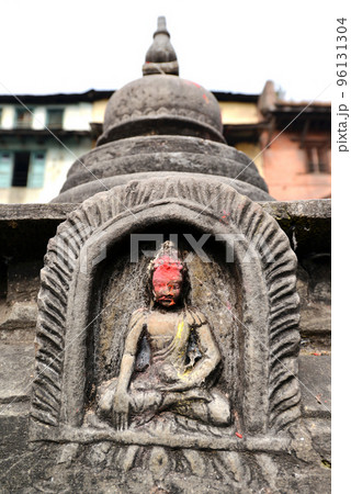 Stone statuette of sitting Buddha in Swayambhunath. Nepal Stone statuette of sitting Buddha in Swayambhunath. Nepal 96131304