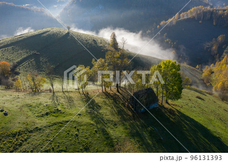 Mountain countryside homestead in the autumn. Wooden barns, aerial drone view 96131393