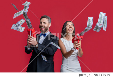 millionaire couple with money gun won jackpot. couple millionaire hold money gun. casino jackpot. millionaire couple with money gun won jackpot. couple millionaire hold money gun. casino jackpot. 96131519