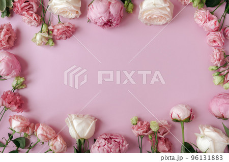 Peonies, roses on pink background with copy space. Abstract natural floral frame layout with text space. Romantic feminine composition. Wedding invitation. International Women day, Mother Day concept Peonies, roses on pink background with copy space. Abstract natural floral frame layout with text space. Romantic feminine composition. Wedding invitation. International Women day, Mother Day concept 96131883