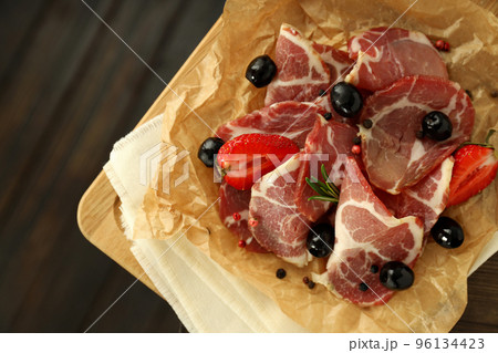 Concept of delicious Spanish cuisine - jamon, close up Concept of delicious Spanish cuisine - jamon, close up 96134423