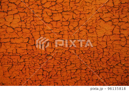 Abstract orange background with cracked texture. Empty back. 96135818