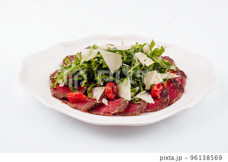 Meat carpaccio with arugula and parmesan cheese 96138569