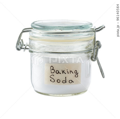 baking soda in a glass storage jar isolated on white background. baking soda in a glass storage jar isolated on white background. 96140564