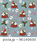 Seamless Christmas pattern with lollipops and red cardinal bird on a blue background 96140600