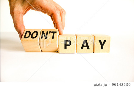 Do not pay symbol. Concept words do not pay on cubes. Businessman hand. Beautiful white table white background. Business, financial crisis and do not pay concept. Copy space. Do not pay symbol. Concept words do not pay on cubes. Businessman hand. Beautiful white table white background. Business, financial crisis and do not pay concept. Copy space. 96142536