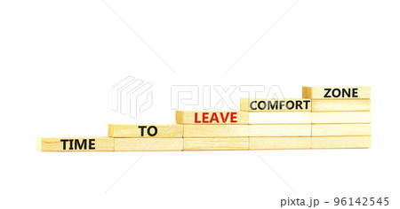 Leave comfort zone symbol. Concept words Time to leave comfort zone on wooden blocks. Beautiful white table white background. Business time to leave comfort zone concept. Copy space. 96142545