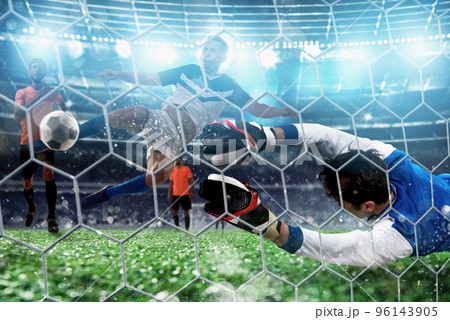 Goalkeeper catches the ball in the stadium during a football game. Goalkeeper catches the ball in the stadium during a football game. 96143905