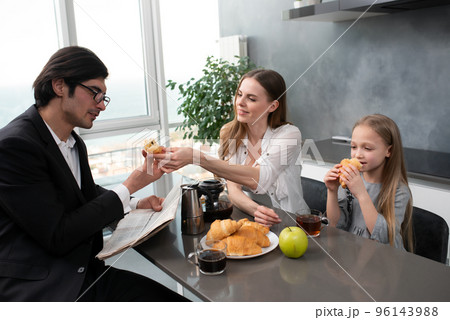 Happy family have a breakfast at home Happy family have a breakfast at home 96143988