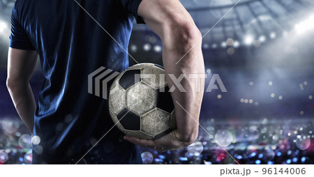 Soccer player ready to play with soccerball at the stadium 96144006