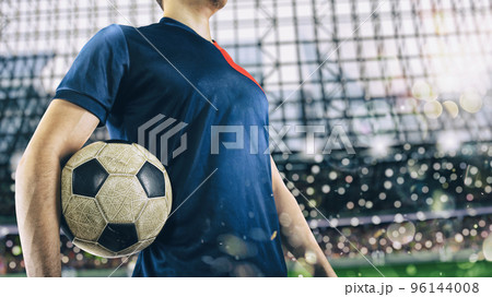 Soccer player ready to play with soccerball at the stadium 96144008