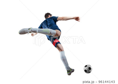 Football scene at night match with player kicking the ball with power. Isolated on white background 96144143