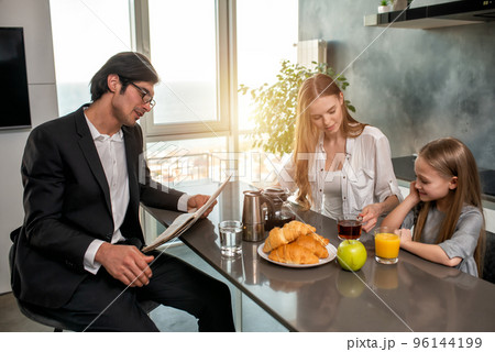 Happy family have a breakfast at home Happy family have a breakfast at home 96144199