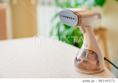 portable hand steamer for clothes. steam for ironing clothes. portable hand steamer for clothes. steam for ironing clothes. 96144371