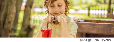 BANNER, LONG FORMAT Adorable little kid boy drinking healthy fruits and vegetables juice smoothie in summer. Happy child enjoying organic drink Portrait of a disgruntled girl sitting at a cafe table BANNER, LONG FORMAT Adorable little kid boy drinking healthy fruits and vegetables juice smoothie in summer. Happy child enjoying organic drink Portrait of a disgruntled girl sitting at a cafe table 96145209