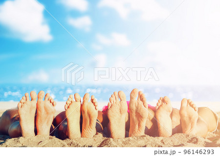 Group of friends having fun on the beach with their foots. Concept of summertime Group of friends having fun on the beach with their foots. Concept of summertime 96146293