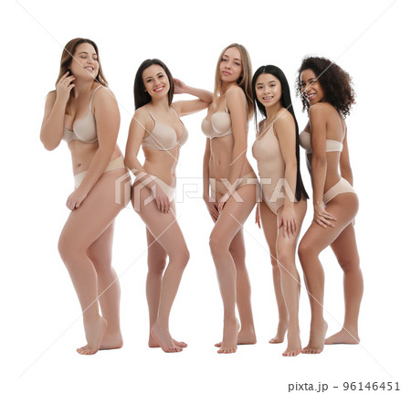 Group of women with different body types in jeans and underwear taking selfie against light Group of women with different body types in jeans and underwear taking selfie against light 96146451