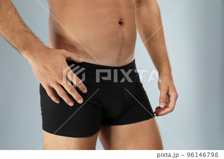 Man in black underwear on light grey background, closeup 96146798